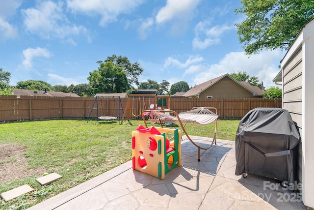 4614 Jacquelyne Dr, Indian Trail, NC 28079 - fenced backyard featuring a playground, a patio, and grilling area