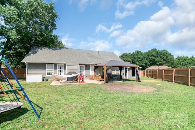 4614 Jacquelyne Dr, Indian Trail, NC 28079 - back of house featuring a gazebo, a patio area, a fenced backyard, roof with shingles, and a playground