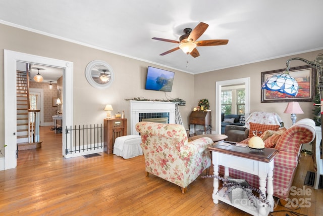 313 E Main St, Morganton, NC 28655 - living room with a ceiling fan, light wood-type flooring, ornamental molding, and a fireplace
