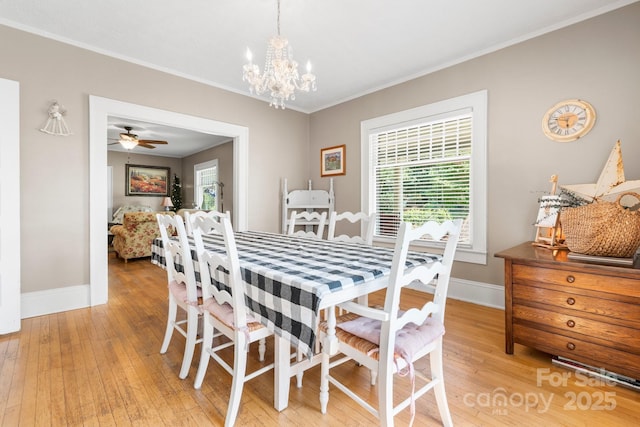 313 E Main St, Morganton, NC 28655 - dining space featuring light wood-style flooring, a chandelier, crown molding, and a ceiling fan