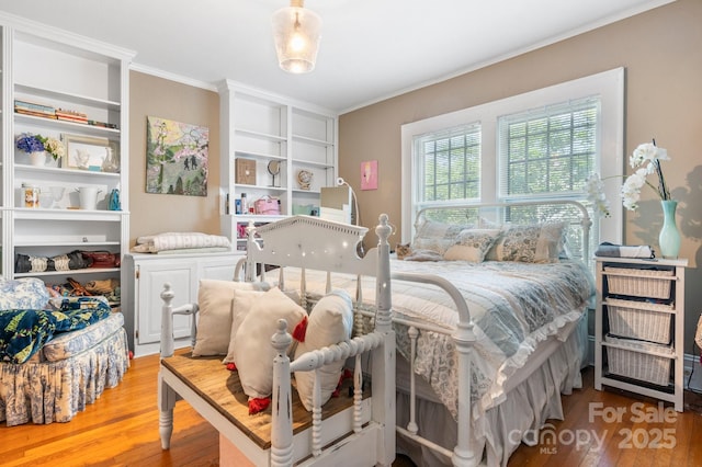 313 E Main St, Morganton, NC 28655 - bedroom featuring wood finished floors and crown molding