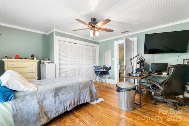 313 E Main St, Morganton, NC 28655 - bedroom featuring a closet, wood finished floors, crown molding, an office area, and ceiling fan