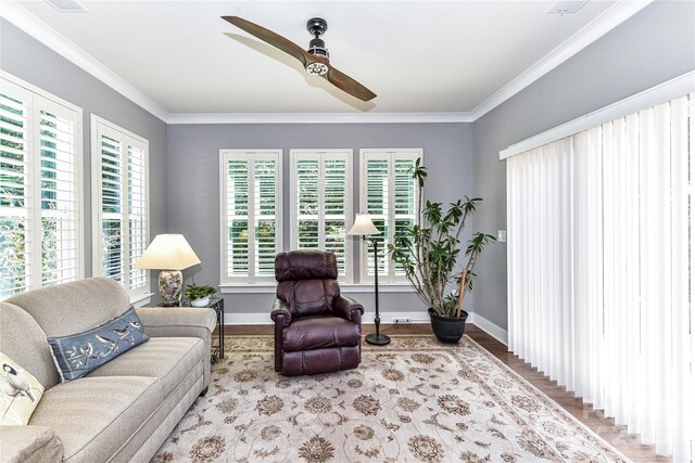 5129 Devonshire Rd, Denver, NC 28037 - living room with plenty of natural light, a ceiling fan, ornamental molding, and wood finished floors