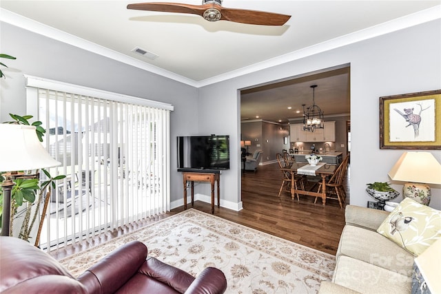 5129 Devonshire Rd, Denver, NC 28037 - living area with crown molding, a ceiling fan, wood finished floors, and a chandelier