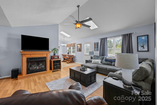2906 Plantation Way, Albemarle, NC 28001 - living area with ceiling fan, light wood-type flooring, a chandelier, a skylight, and high vaulted ceiling