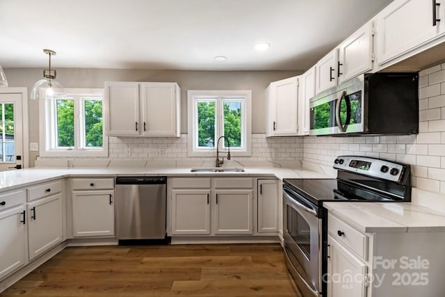 7724 E Holly Grove Rd, Thomasville, NC 27360 - kitchen with appliances with stainless steel finishes, plenty of natural light, white cabinetry, and recessed lighting