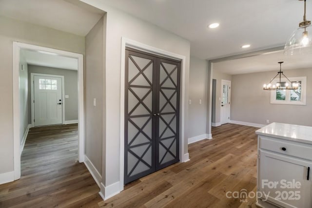 7724 E Holly Grove Rd, Thomasville, NC 27360 - hallway with a chandelier, wood finished floors, and recessed lighting