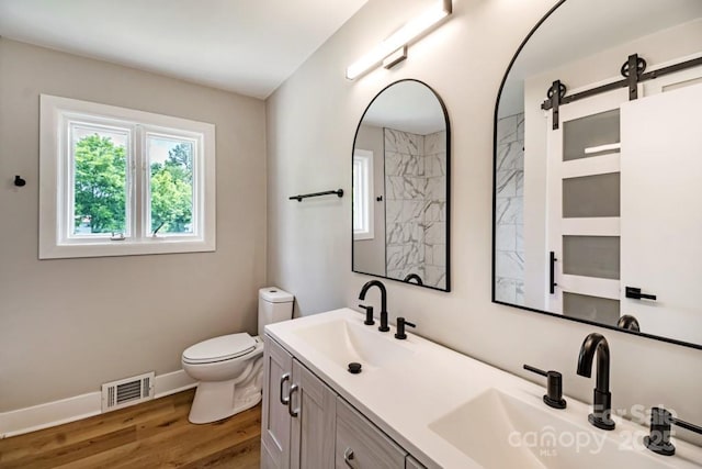 7724 E Holly Grove Rd, Thomasville, NC 27360 - full bath featuring double vanity, wood finished floors, and a shower