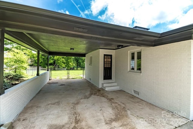 7724 E Holly Grove Rd, Thomasville, NC 27360 - view of patio featuring entry steps, an attached carport, and a gate