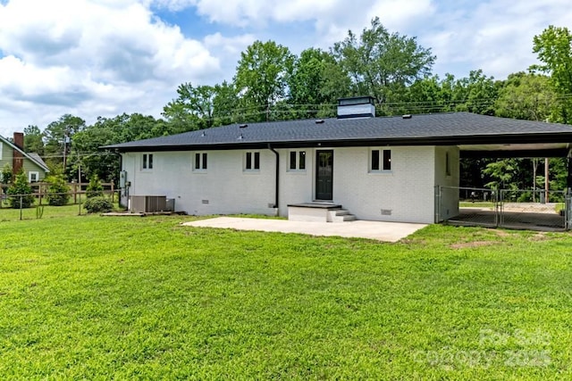 7724 E Holly Grove Rd, Thomasville, NC 27360 - back of house with crawl space, brick siding, a patio area, and a chimney