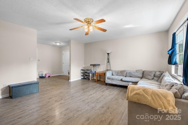 1265 39th Street Cir, Hickory, NC 28602 - living area featuring a ceiling fan, wood finished floors, cooling unit, and a textured ceiling