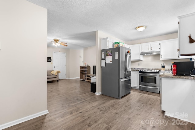 1265 39th Street Cir, Hickory, NC 28602 - kitchen featuring appliances with stainless steel finishes, under cabinet range hood, white cabinets, a ceiling fan, and a textured ceiling