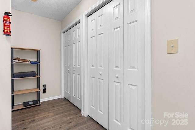 1265 39th Street Cir, Hickory, NC 28602 - corridor with dark wood-style flooring and a textured ceiling