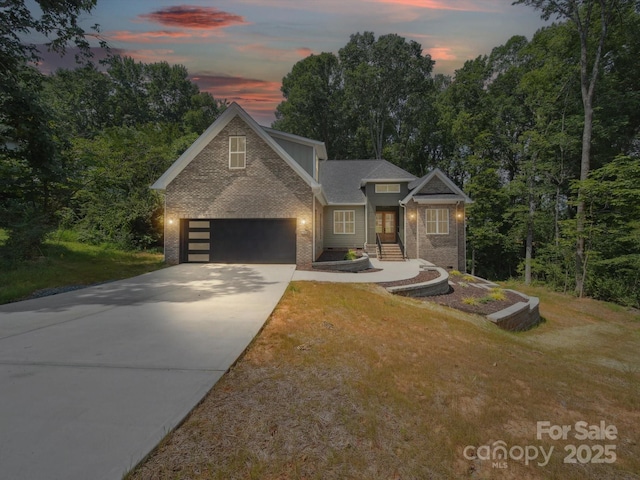 2108 Lakeview Cir, Matthews, NC 28105 - traditional-style house with brick siding, concrete driveway, a lawn, and an attached garage
