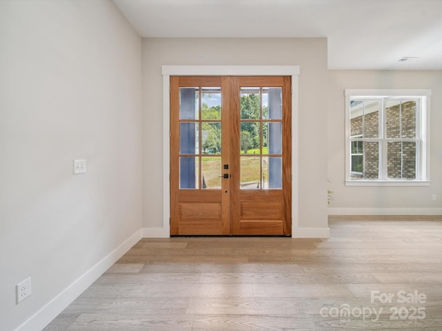 2108 Lakeview Cir, Matthews, NC 28105 - foyer featuring light wood-type flooring and french doors