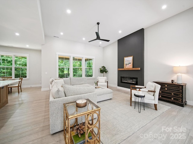 2108 Lakeview Cir, Matthews, NC 28105 - living area with plenty of natural light, light wood-type flooring, recessed lighting, a large fireplace, and a ceiling fan