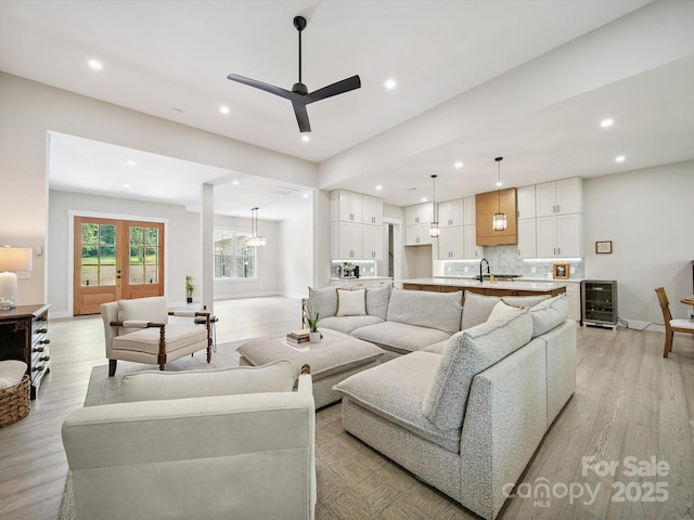 2108 Lakeview Cir, Matthews, NC 28105 - living room with light wood-style flooring, beverage cooler, recessed lighting, and ceiling fan
