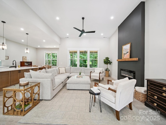 2108 Lakeview Cir, Matthews, NC 28105 - living room featuring recessed lighting, a ceiling fan, and a glass covered fireplace