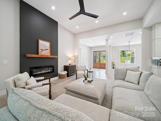 2108 Lakeview Cir, Matthews, NC 28105 - living area with a ceiling fan, light wood-type flooring, recessed lighting, and a glass covered fireplace