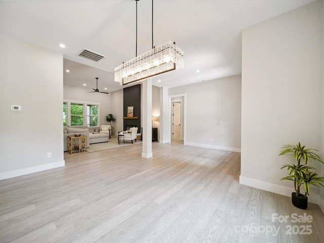 2108 Lakeview Cir, Matthews, NC 28105 - unfurnished living room featuring light wood finished floors and recessed lighting