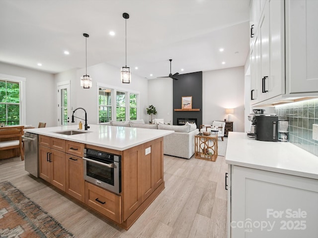 2108 Lakeview Cir, Matthews, NC 28105 - kitchen featuring appliances with stainless steel finishes, light wood-type flooring, plenty of natural light, and recessed lighting