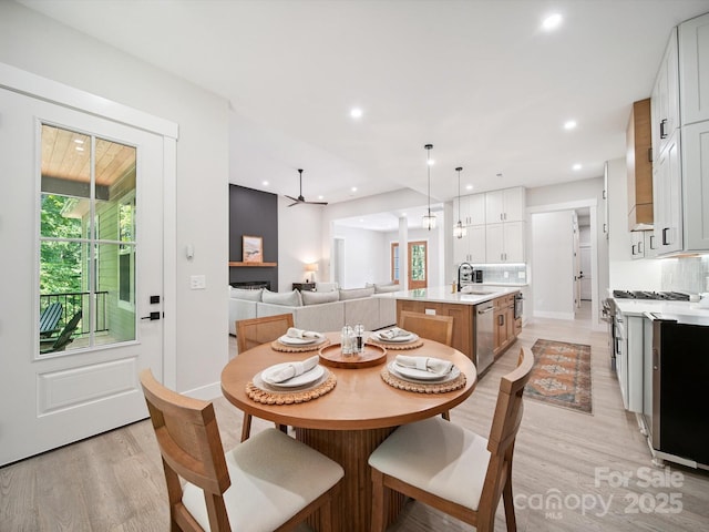 2108 Lakeview Cir, Matthews, NC 28105 - dining space with light wood-type flooring, recessed lighting, and a ceiling fan