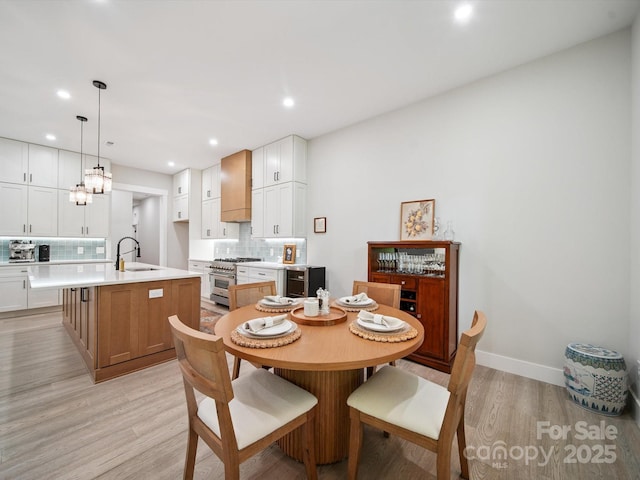 2108 Lakeview Cir, Matthews, NC 28105 - dining area featuring light wood-type flooring, recessed lighting, and a chandelier