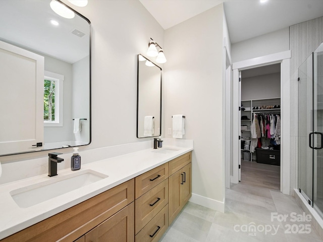2108 Lakeview Cir, Matthews, NC 28105 - full bath with double vanity, a shower stall, a spacious closet, and recessed lighting
