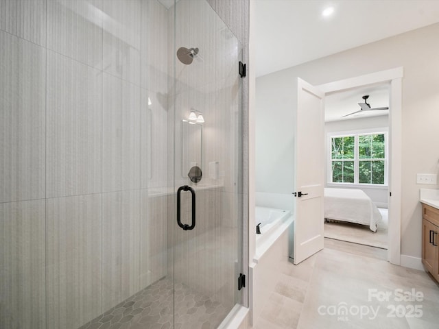 2108 Lakeview Cir, Matthews, NC 28105 - ensuite bathroom featuring a garden tub, a stall shower, vanity, and a ceiling fan