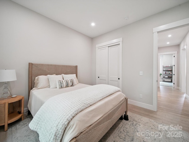 2108 Lakeview Cir, Matthews, NC 28105 - bedroom with light wood finished floors, a closet, and recessed lighting