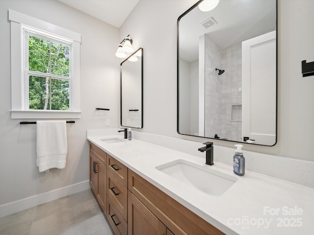 2108 Lakeview Cir, Matthews, NC 28105 - bathroom with double vanity and a tile shower