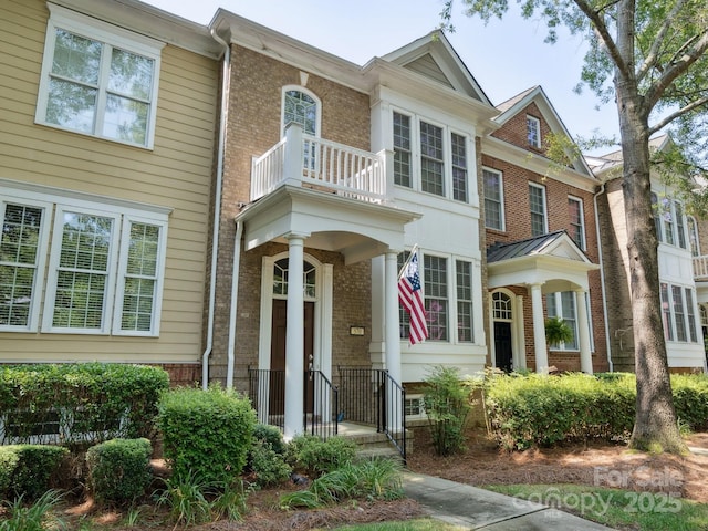570 Sixth Baxter Xing Unit 16, Fort Mill, SC 29708 - view of front of house featuring a balcony and brick siding
