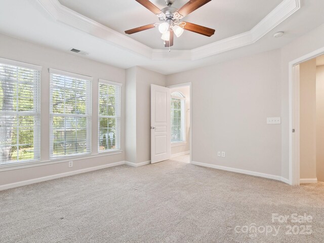 570 Sixth Baxter Xing Unit 16, Fort Mill, SC 29708 - empty room featuring a raised ceiling, ornamental molding, a ceiling fan, light carpet, and a smoke detector