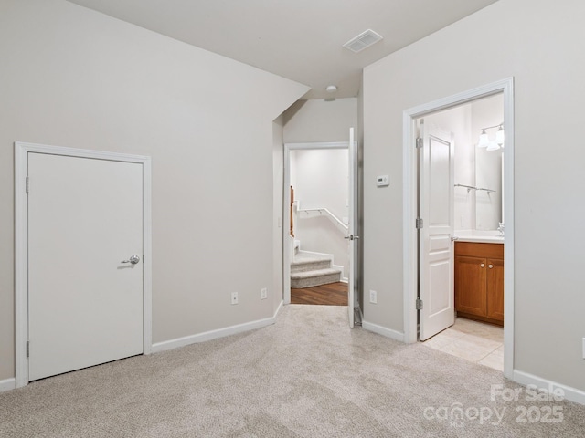 570 Sixth Baxter Xing Unit 16, Fort Mill, SC 29708 - unfurnished bedroom featuring light colored carpet and ensuite bath