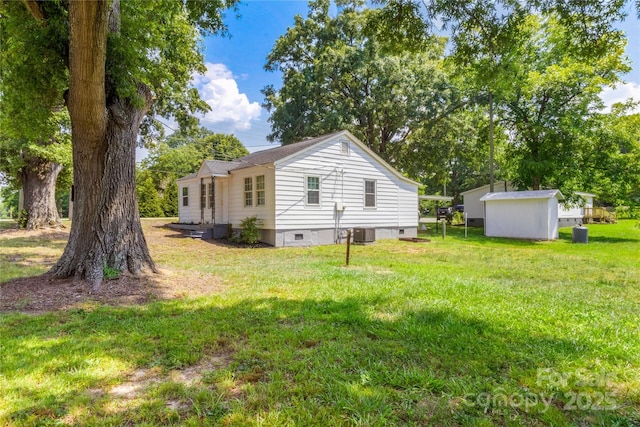2488 Catawba Church Rd, Rock Hill, SC 29730 - view of property exterior with crawl space, a lawn, and a storage shed