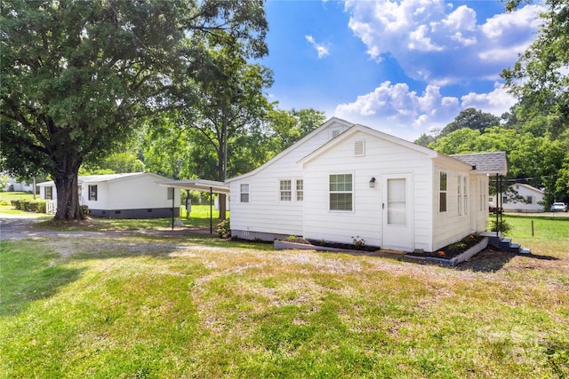 2488 Catawba Church Rd, Rock Hill, SC 29730 - rear view of property featuring a lawn and a detached carport