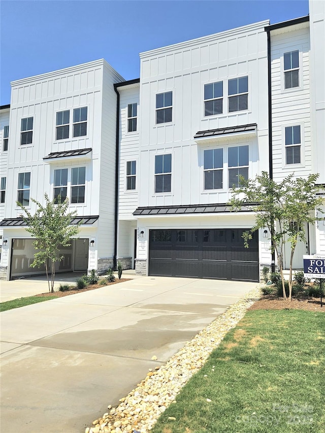 2137 Barrowcliffe Dr Unit 49, Concord, NC 28027 - multi unit property with a standing seam roof, an attached garage, concrete driveway, board and batten siding, and a metal roof