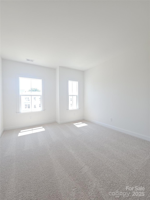 2137 Barrowcliffe Dr Unit 49, Concord, NC 28027 - spare room with baseboards and carpet flooring