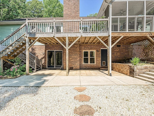 14019 Fountain Ln, Charlotte, NC 28278 - rear view of house with stairway, a patio, brick siding, and a chimney