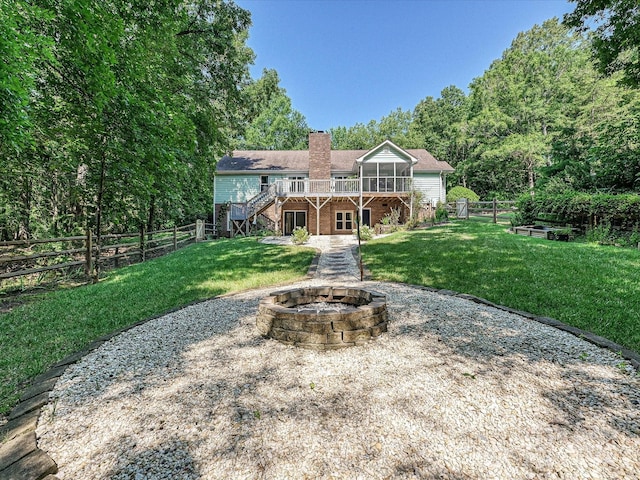14019 Fountain Ln, Charlotte, NC 28278 - rear view of house featuring stairs, an outdoor fire pit, a wooden deck, a chimney, and brick siding