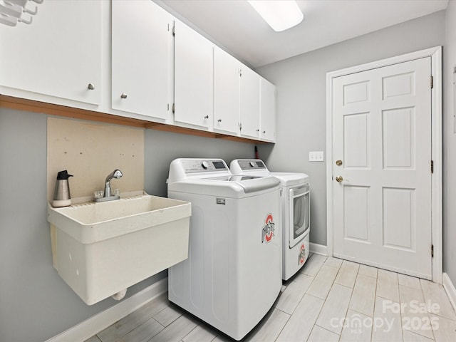 14019 Fountain Ln, Charlotte, NC 28278 - laundry area featuring separate washer and dryer and cabinet space