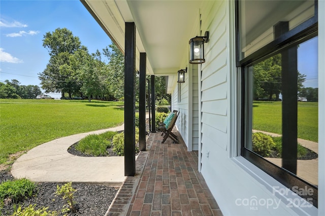 7109 Forney Hill Rd, Denver, NC 28037 - covered porch featuring a yard
