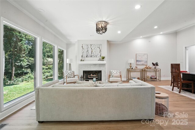 7109 Forney Hill Rd, Denver, NC 28037 - living area with light wood finished floors, recessed lighting, a high end fireplace, lofted ceiling, and crown molding