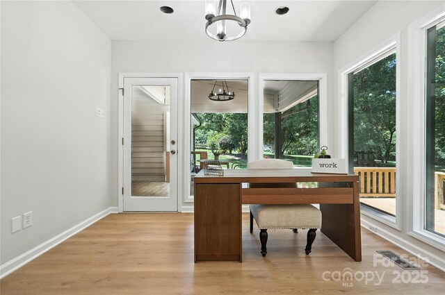 7109 Forney Hill Rd, Denver, NC 28037 - home office featuring a chandelier, plenty of natural light, and light wood finished floors