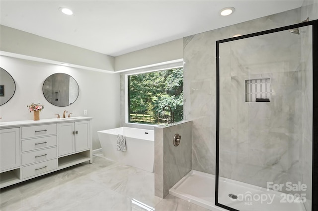 7109 Forney Hill Rd, Denver, NC 28037 - bathroom with double vanity, a freestanding tub, a tile shower, marble finish flooring, and recessed lighting
