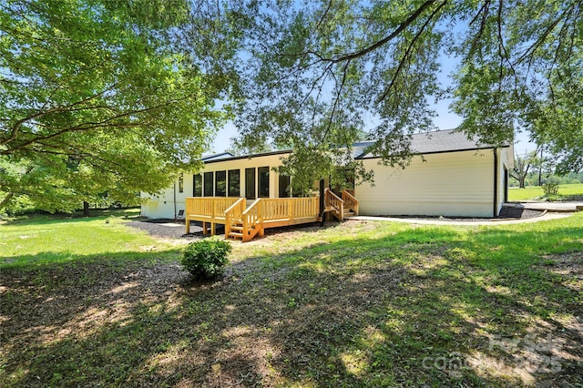 7109 Forney Hill Rd, Denver, NC 28037 - back of property featuring a sunroom, a yard, and a deck