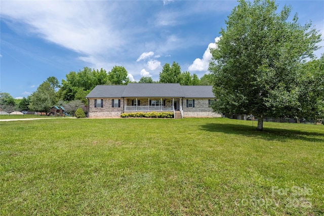205 Honey Moss Ln, Salisbury, NC 28146 - single story home featuring a porch, a front lawn, and a playground