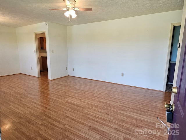 1982 Conley Rd, Morganton, NC 28655 - spare room with a textured ceiling, ceiling fan, and wood finished floors