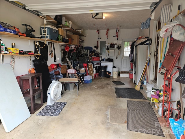 1982 Conley Rd, Morganton, NC 28655 - garage featuring a garage door opener, electric panel, and a workshop area