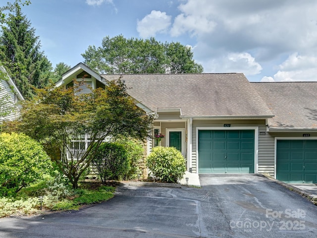 621 E Park Pl, Hendersonville, NC 28791 - multi unit property with driveway, an attached garage, and roof with shingles